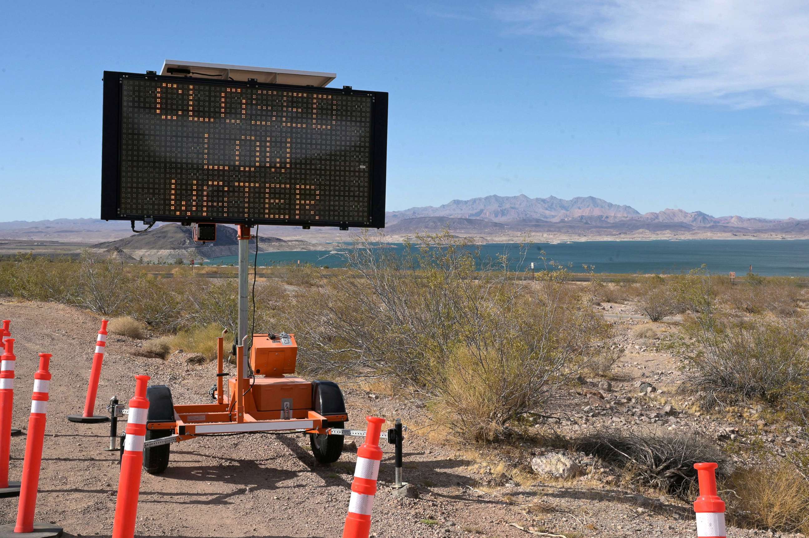 PHOTO: A sign notifies a boat launch is closed because of low water levels due to drought in the Hoover Dam reservoir of Lake Mead near Las Vegas,  June 9, 2021. 