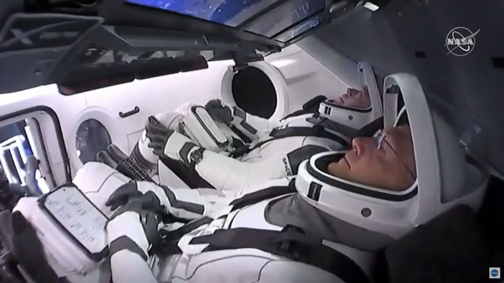 PHOTO: In this still image taken from NASA TV, NASA astronauts Bob Behnken (rear) and Doug Hurley are strapped in the SpaceX Crew Dragon capsule at Kennedy Space Center in Florida for their launch to the International Space Station on May 30, 2020.
