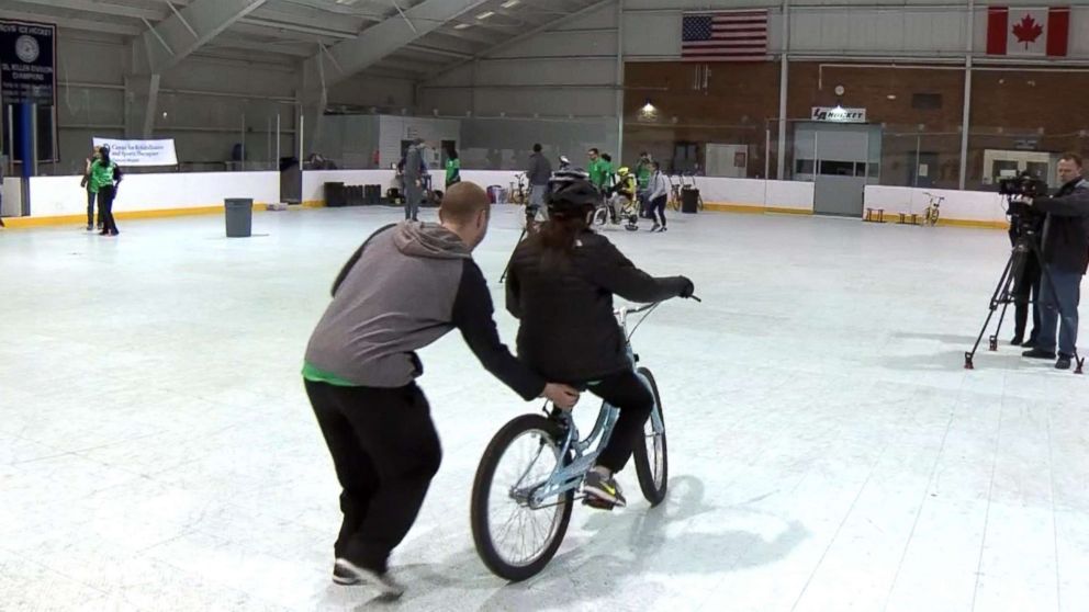 PHOTO: Kids participate in a week-long bike camp run by Emerson Hospital in Groton, Mass., teaching children with special needs to ride bikes, April 2018.