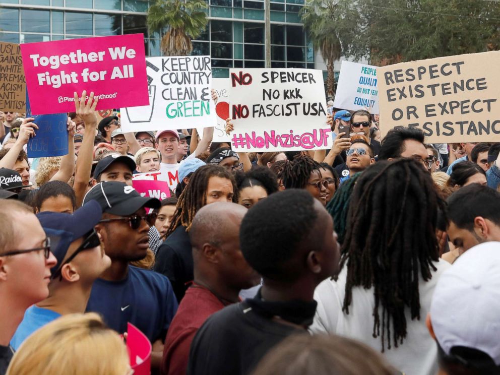 PHOTO: Demonstrators rally before the speech by Richard Spencer, an avowed white nationalist and spokesperson for the so-called alt-right movement, on the campus of the University of Florida in Gainesville, Florida, Oct. 19, 2017.