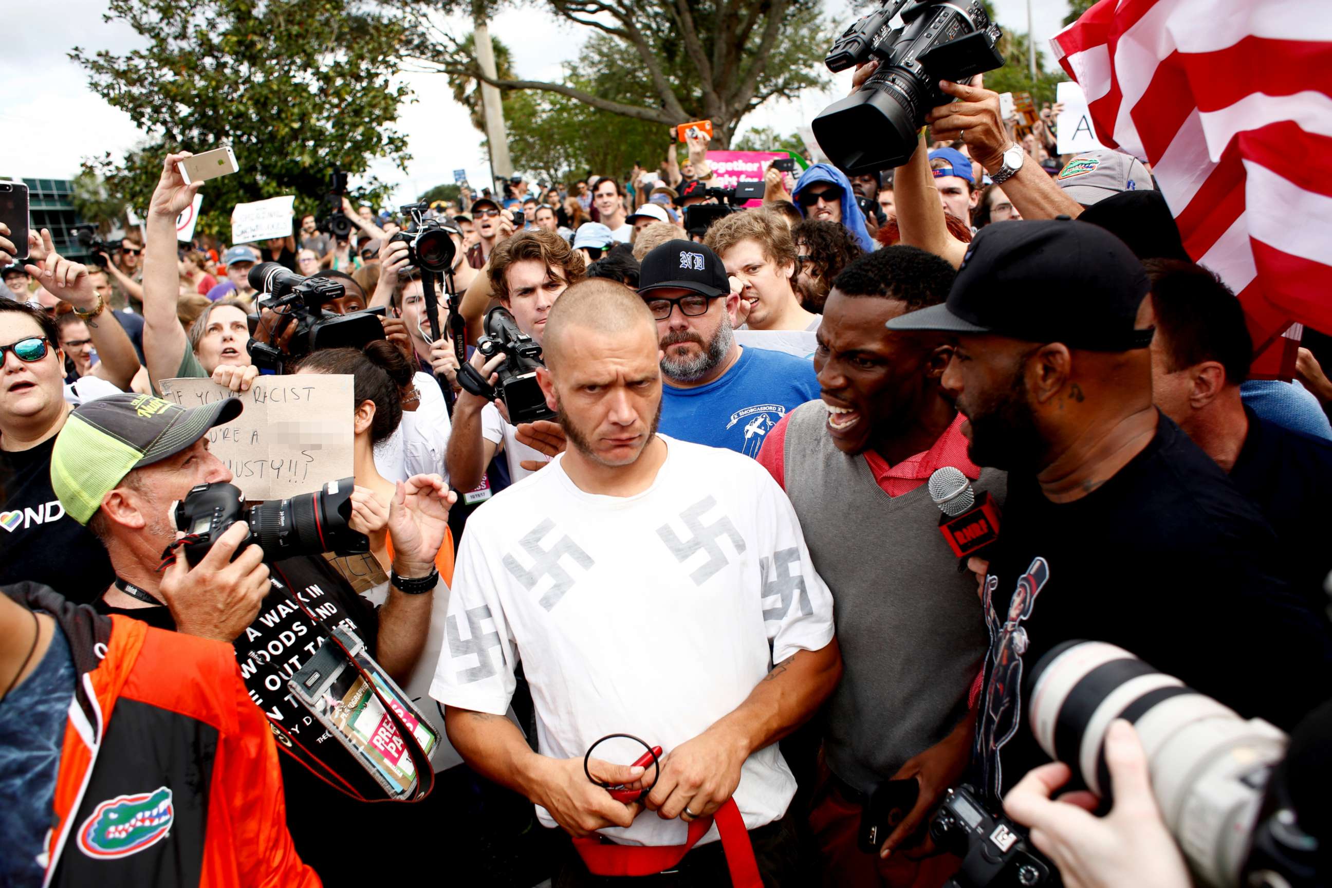PHOTO: A man wearing a shirt with swastikas is forced away from the scene by the crowd near the site of a planned speech by white nationalist Richard Spencer at the University of Florida campus, Oct. 19, 2017, in Gainesville, Florida.