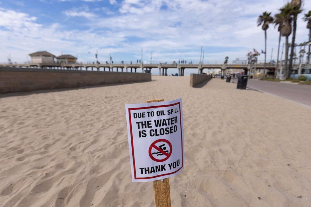 PHOTO: A warning sign is posted for people to stay out of the water after a major oil spill off the coast of California came ashore in Huntington Beach, Calif., Oct. 4, 2021.