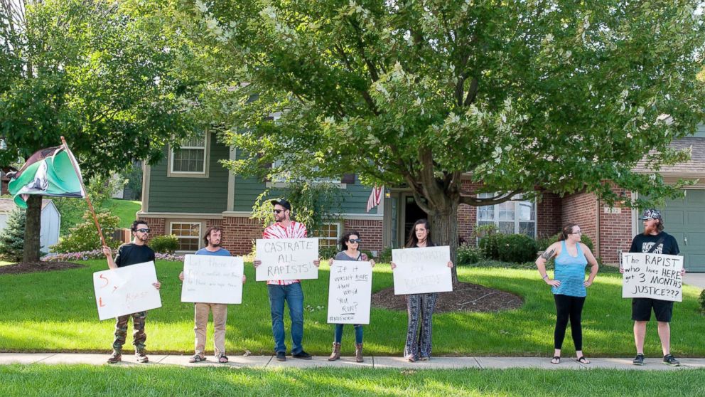 PHOTO: Protesters stand outside the family home of Brock Turner in Sugarcreek Township, Ohio, Sept. 3, 2016.