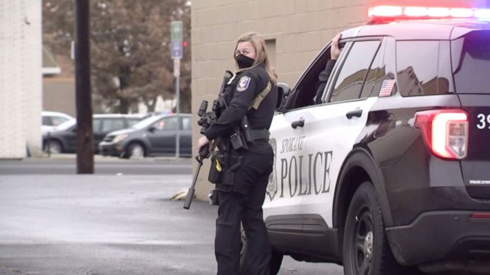 PHOTO: Spokane police stand outside the Spokane County Democrats headquarters on Dec. 9, 2020, after a man walked into the building and threatened to blow it up. He was arrested with a fake explosive device.