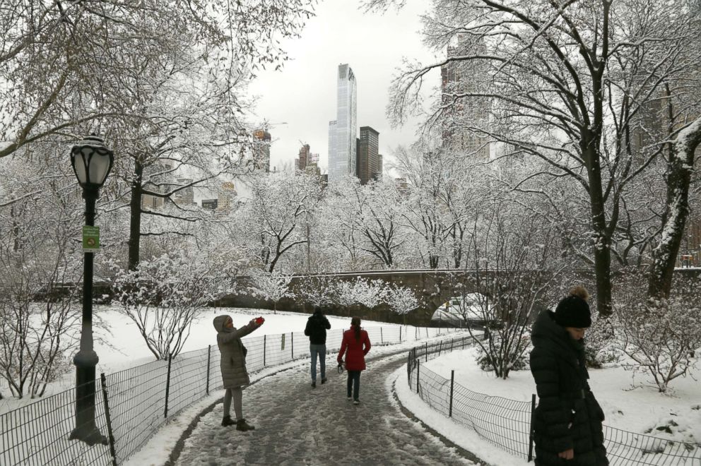 PHOTO: New Yorkers enjoy the morning snow in Central Park after an early spring storm on April 2, 2018 in New York.