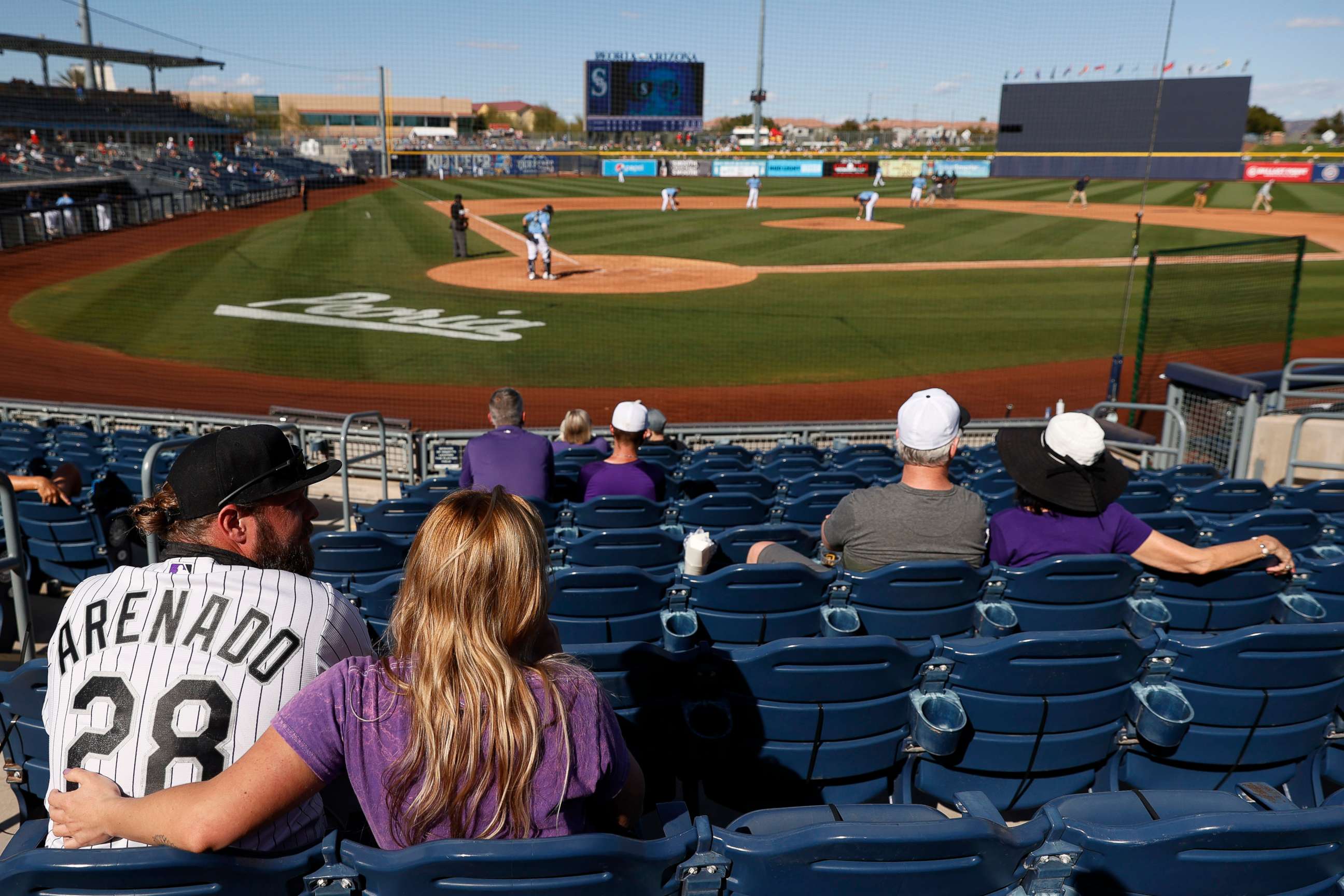PHOTO: Fans watch an MLB spring training game between the Seattle Mariners and the Colorado Rockies at Peoria Sports Complex on March 04, 2021 in Peoria, Ariz.