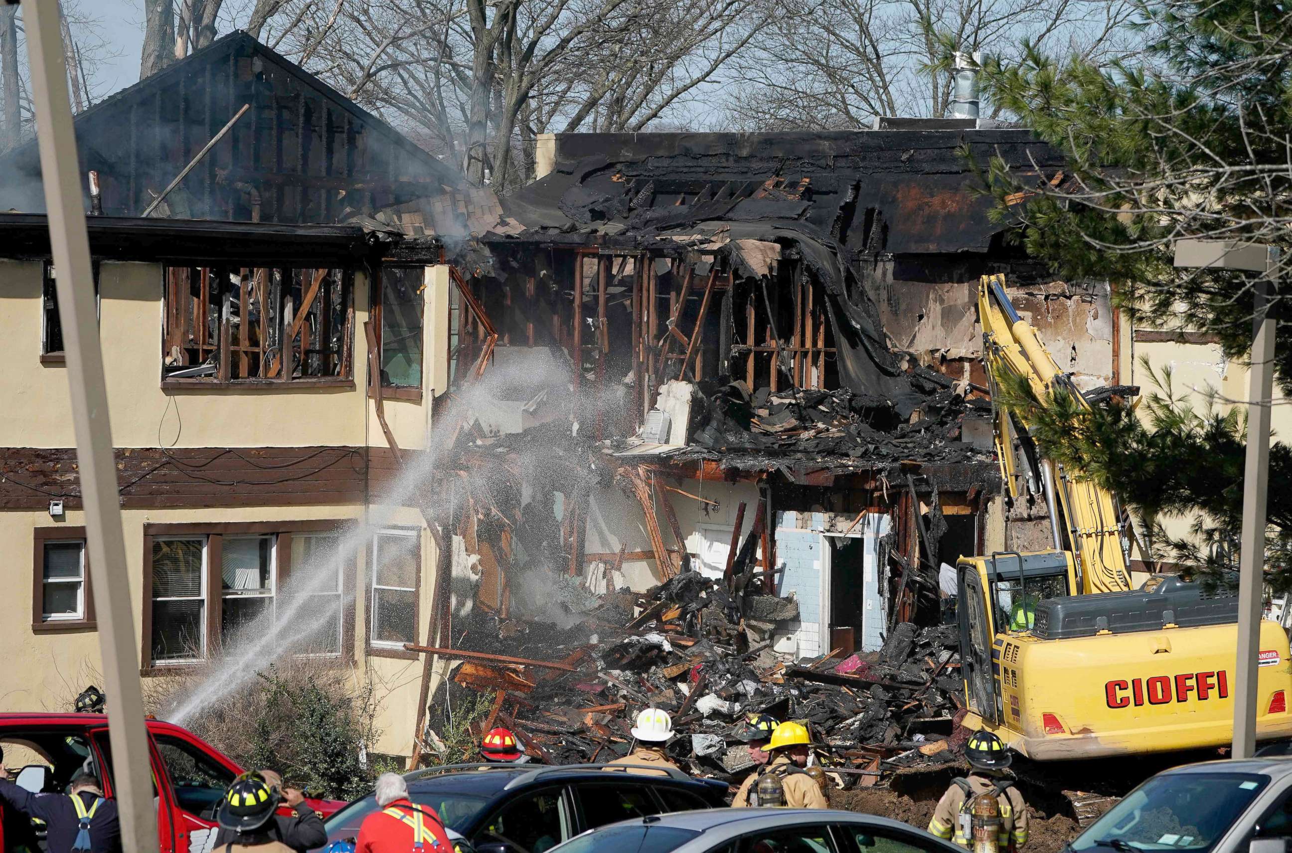 PHOTO: Firefighters work on extinguishing hotspots from a fire that burned down the Evergreen Court Home for Adults, March 23, 2021, in Spring Valley, N.Y.