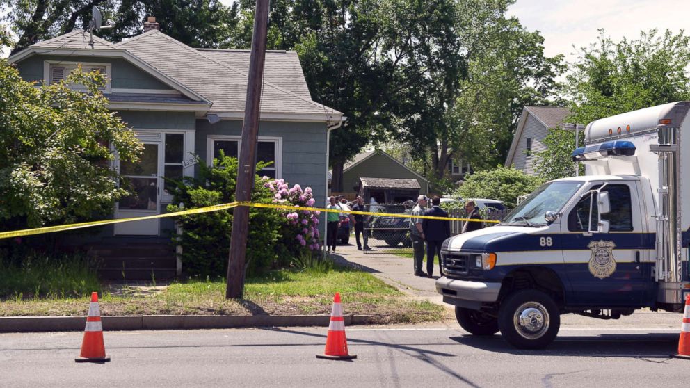 Springfield Police work at the scene where two bodies were found Wednesday in Springfield, Mass., a house connected to Stewart Weldon, currently being held on other charges, May 31, 2018.
