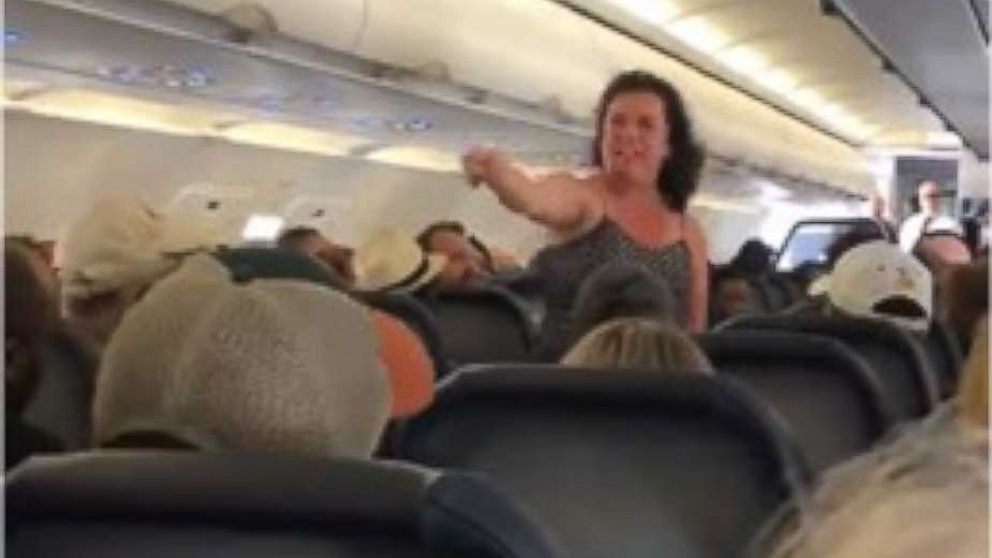 A woman was removed from a flight after she unleashed a profanity-laden tirade after the plane made an emergency landing.