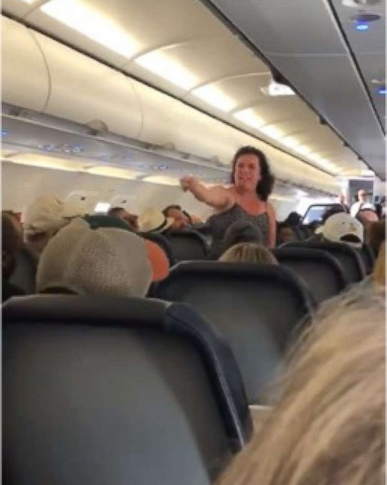 A woman was removed from a flight after she unleashed a profanity-laden tirade after the plane made an emergency landing.