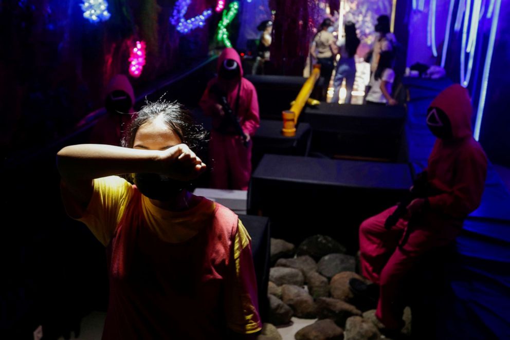 PHOTO: A customer plays the 'Red Light, Green Light' game from the Netflix show "Squid Game" at Strawberry Cafe in Jakarta, Indonesia, Oct. 15, 2021.