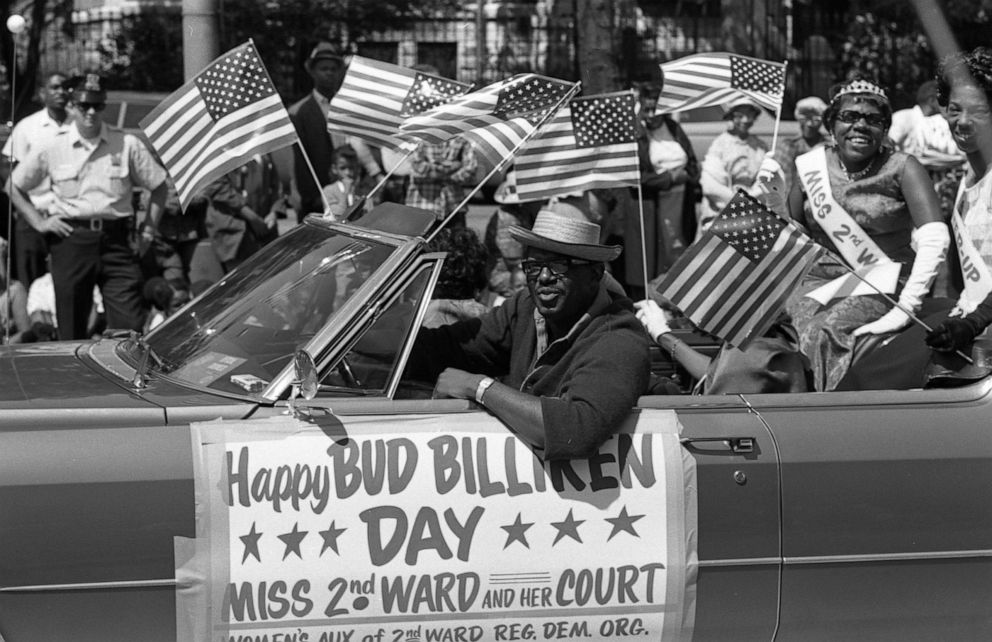 PHOTO: Miss 2nd Ward and her court smile and wave while riding in a convertible during the Bud Billiken Day parade, Chicago, in 1967. 
