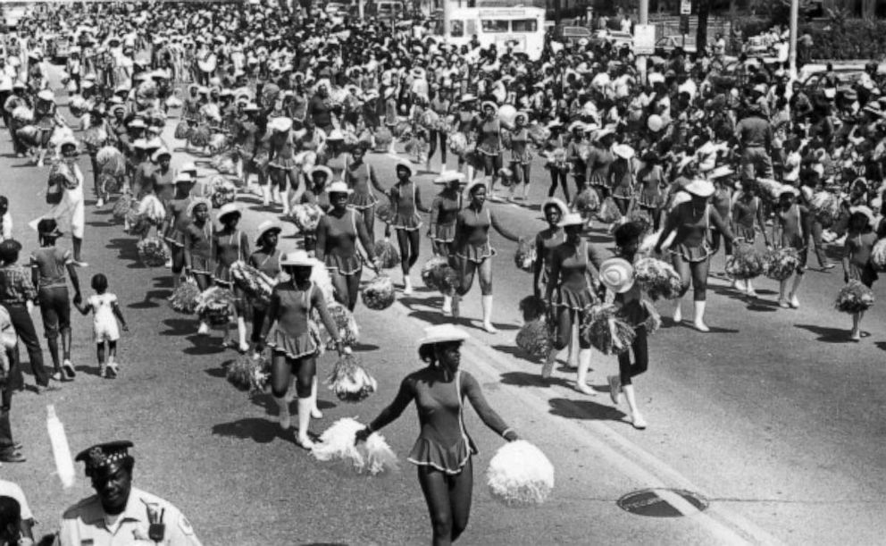 PHOTO: Cheerleaders from a local school walk the parade route during the annual Bud Billiken parade, sponsored by the Chicago Defender, in Chicago, in 1984. 