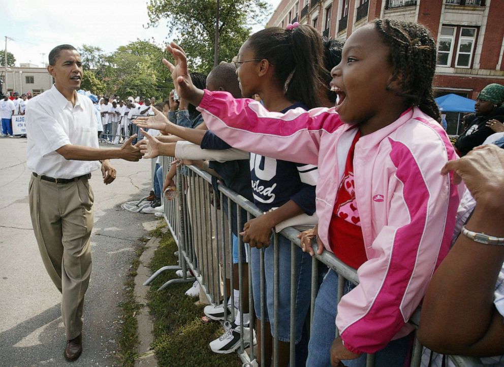 PHOTO: Barack Obama, Democratic candidate for U.S. Senate from Illinois, campaigns during the Bud Billiken parade, Aug. 14, 2004, on the South Side of Chicago. Obama marched the parade route with his wife Michelle and several hundred supporters.  
