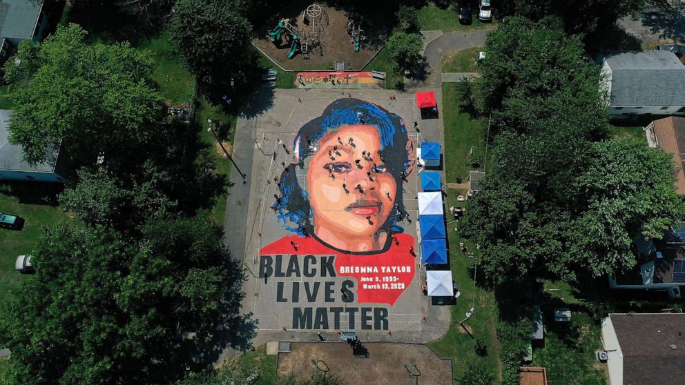PHOTO: In an aerial view from a drone, a large-scale ground mural depicting Breonna Taylor with the text 'Black Lives Matter' is seen being painted at Chambers Park on July 5, 2020, in Annapolis, Md.