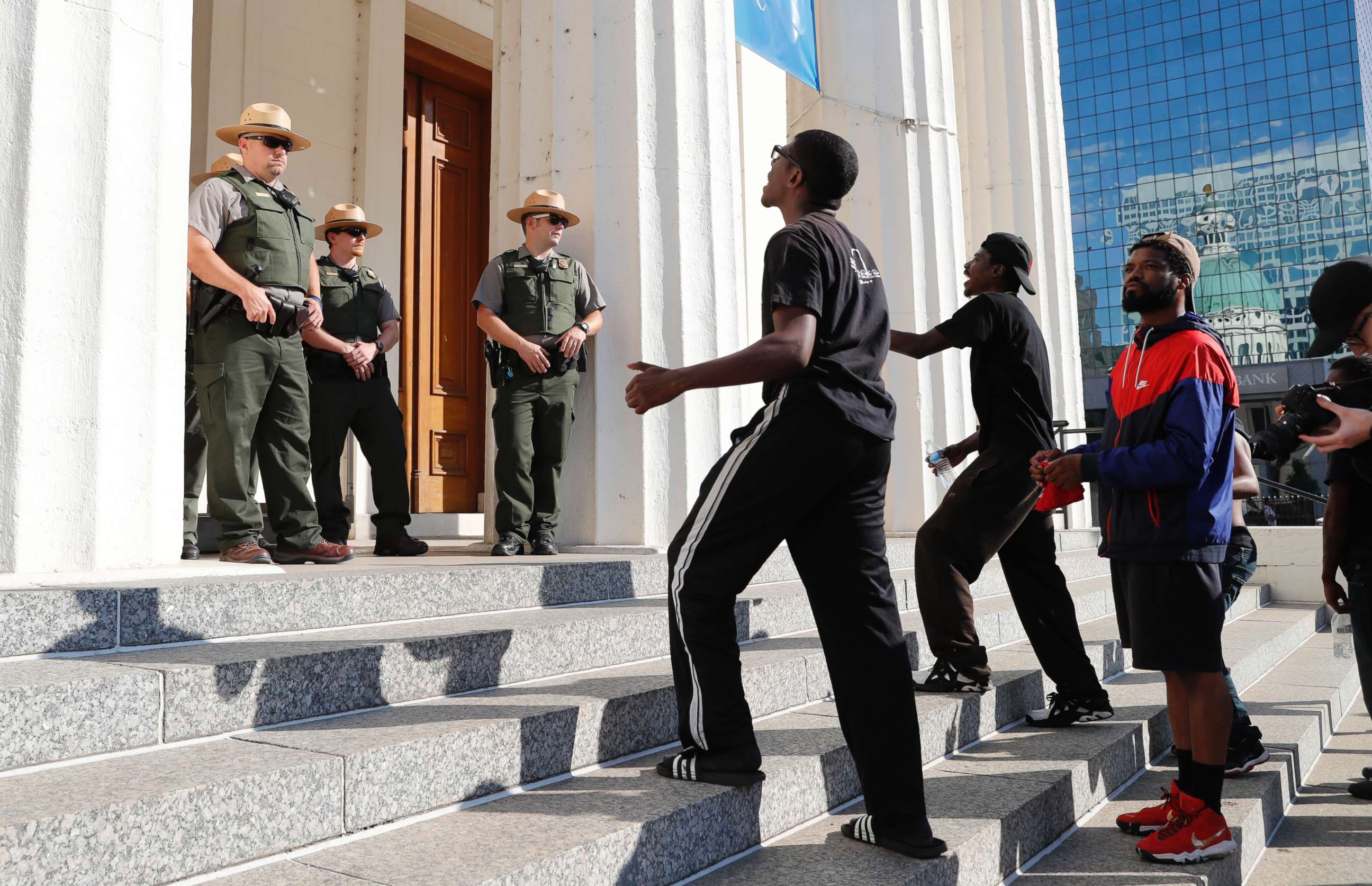 PHOTO: Protesters yell at law enforcement officers on the steps of the Old Courthouse following a verdict in the trial of former St. Louis police officer Jason Stockley in St. Louis on, Sept. 15, 2017.