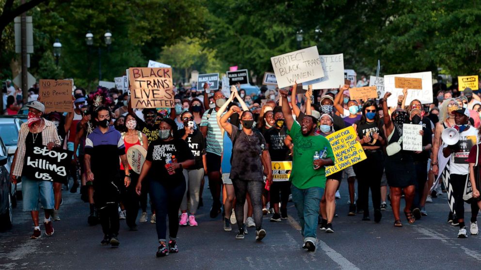 PHOTO: Hundreds of protesters march down Waterman Boulevard headed to St. Louis Mayor Lyda Krewson's home on June 28, 2020, in St. Louis.