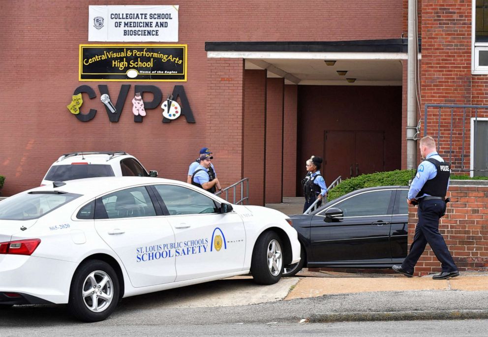 PHOTO: St. Louis metropolitan police officers stand outside an entrance at the northeast corner of the Central Visual and Performing Arts High School after a shooting that left three people dead including the shooter, Oct. 24, 2022, in St. Louis.