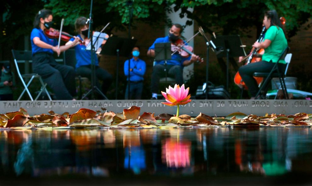 PHOTO: Members of the St. Louis Symphony Quintet perform for medical workers on the campus of the Washington University School of Medicine and Barnes-Jewish Hospital on Ellen S. Clark Hope Plaza in St. Louis, Missouri, on Sept. 24, 2020.