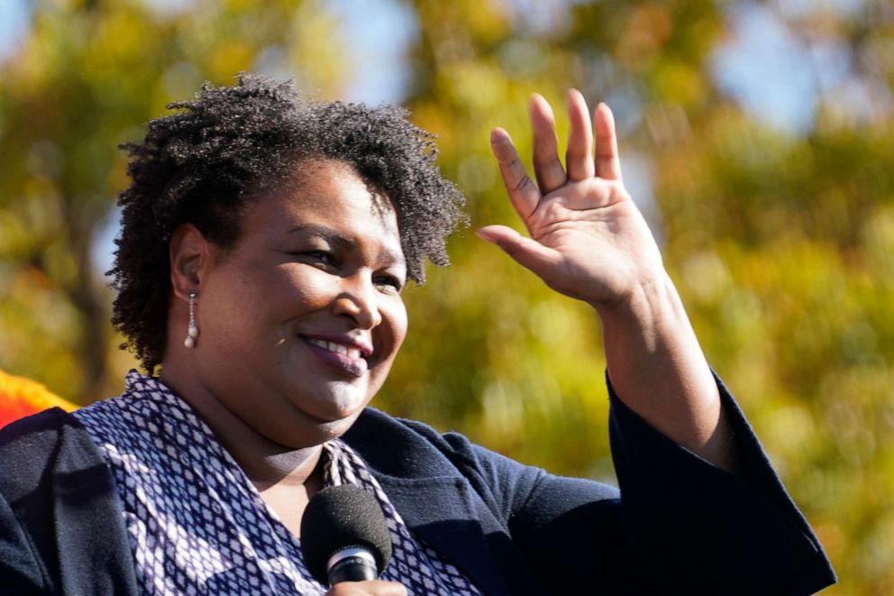 PHOTO: Stacey Abrams speaks to Biden supporters as they wait for former President Barack Obama to arrive and speak at a campaign rally for Biden at Turner Field in Atlanta, Nov. 2, 2020.