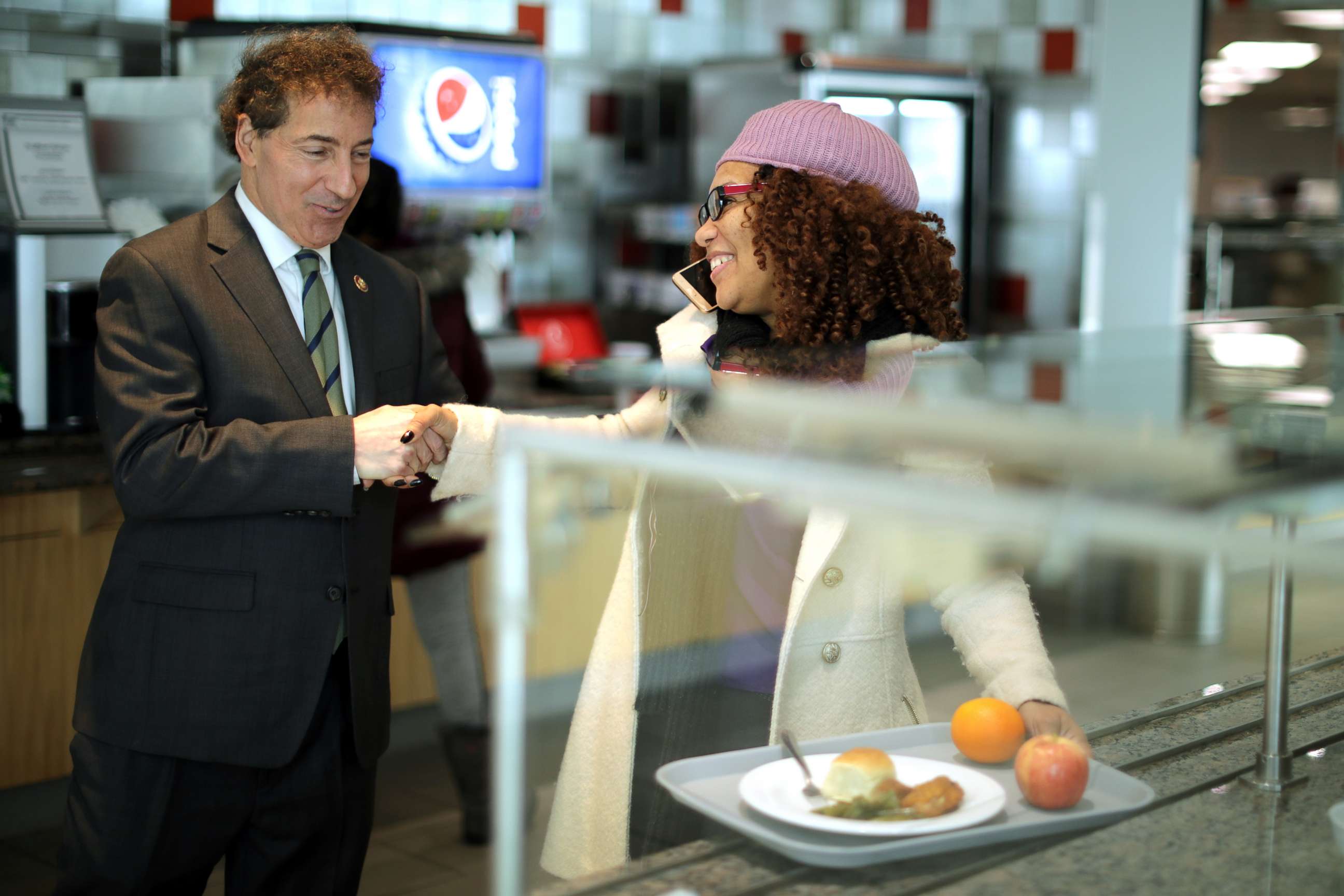 PHOTO: Rep. Jamie Raskin greets Consumer Product Safety Commission employee Stacy Summerville as she gathered her lunch in the cafeteria at the Tommy Douglas Conference Center, Jan. 14, 2019, in Silver Spring, Maryland.