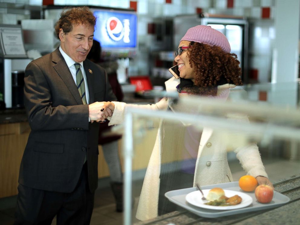 PHOTO: Rep. Jamie Raskin greets Consumer Product Safety Commission employee Stacy Summerville as she gathered her lunch in the cafeteria at the Tommy Douglas Conference Center, Jan. 14, 2019, in Silver Spring, Maryland.