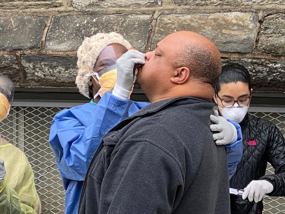 PHOTO: Dr. Stanford tests Tony for COVID-19 outside of a Philadelphia church.