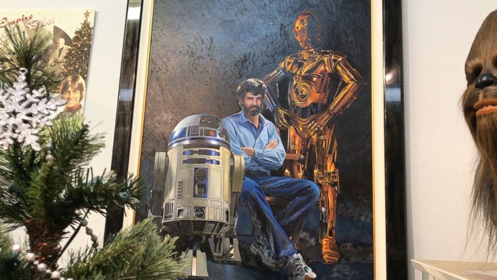 PHOTO: A fan-made painting of Star Wars creator George Lucas along with droids C-3PO and R2-D2 hangs on the wall at Rancho Obi Wan. 