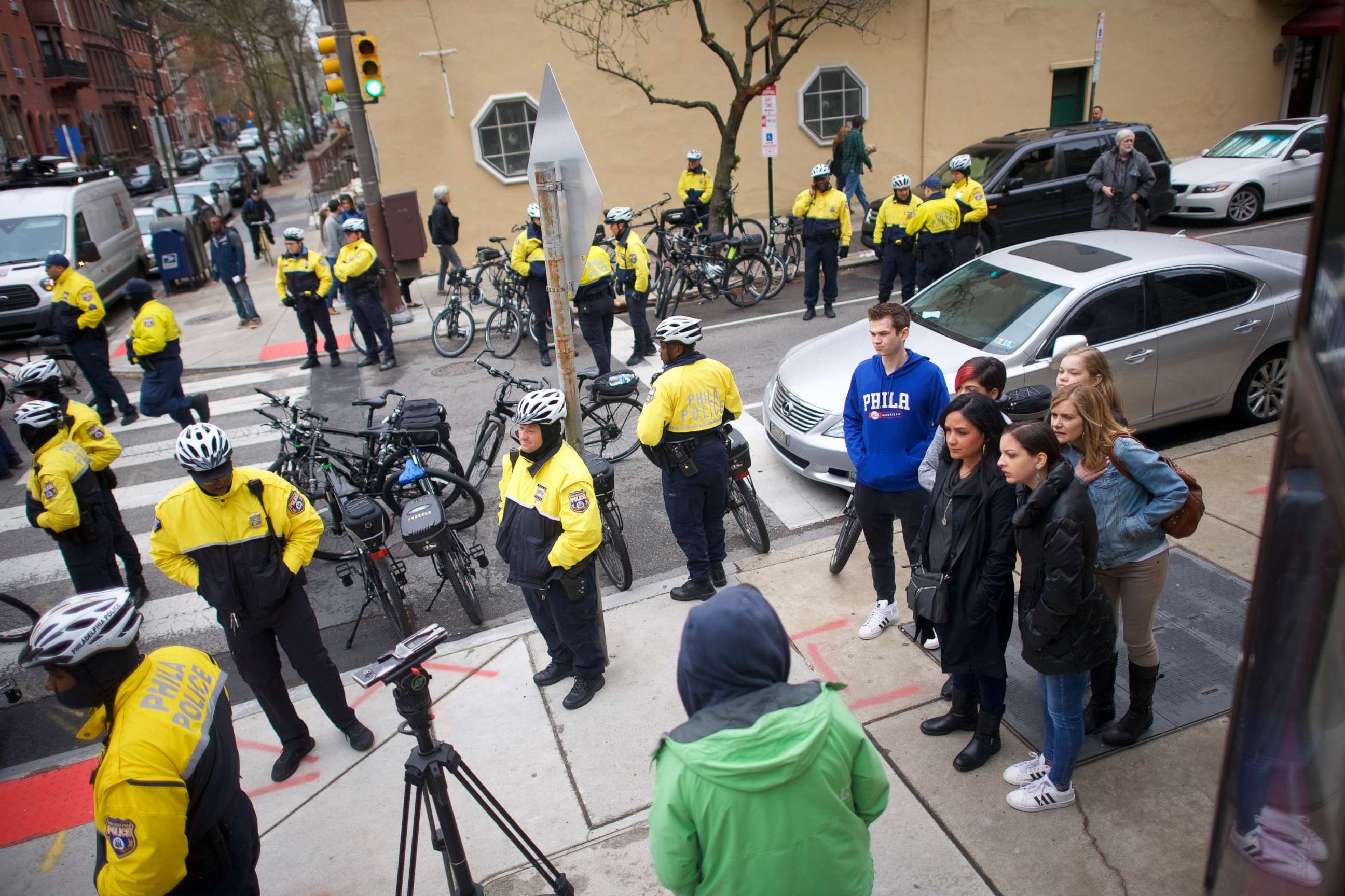 PHOTO: A group of people observe protesters demonstrating outside a Center City Starbucks on April 15, 2018 in Philadelphia, Pennsylvania.