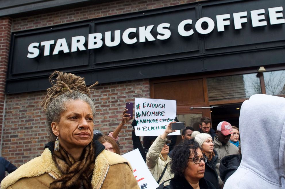 PHOTO: Michelle Brown, 50, left, demonstrates outside a Center City Starbucks, April 15, 2018 in Philadelphia.