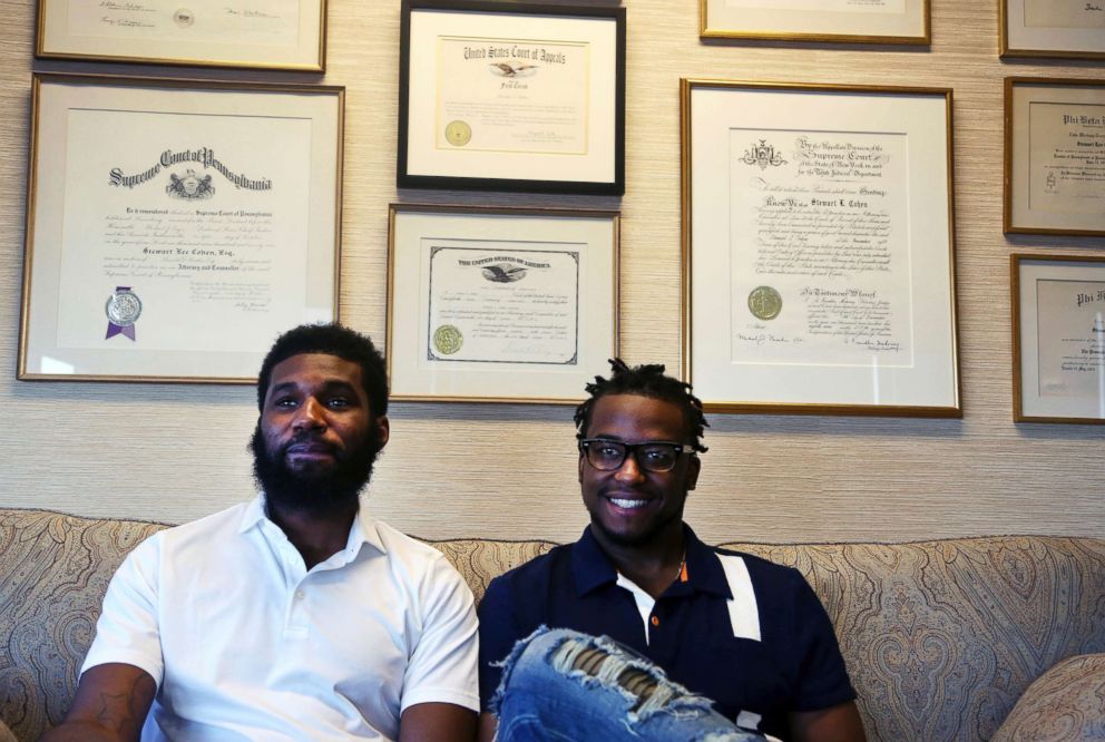 PHOTO: Rashon Nelson, left, and Donte Robinson, right, sit on their attorney's sofa as they pose for a portrait following an interview with The Associated Press in Philadelphia, April 18, 2018.