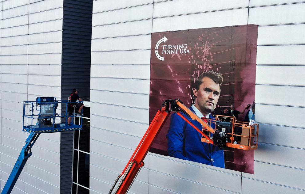 PHOTO: A Sept. 19, 2025, drone view of workers installing a photo of slain conservative commentator Charlie Kirk is shown ahead of a memorial service to be held for him on Sept. 21, at State Farm Stadium, in Glendale, Arizona.