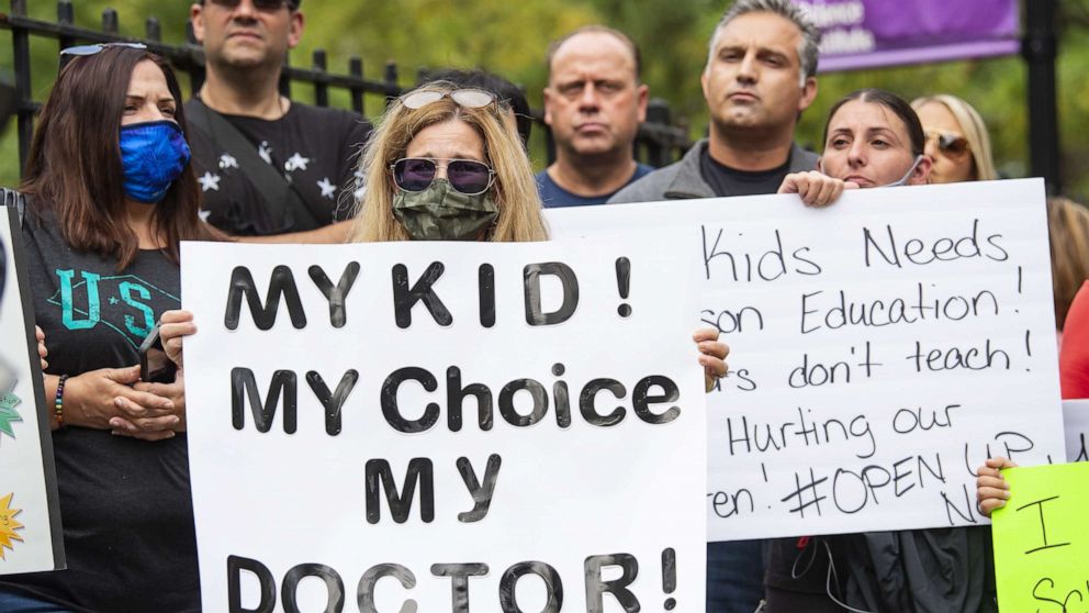 PHOTO: Parents and students gather to protest plans for the New York City public school system, including the required Covid testing by school doctors, in Staten Island, New York, Oct. 1, 2020.