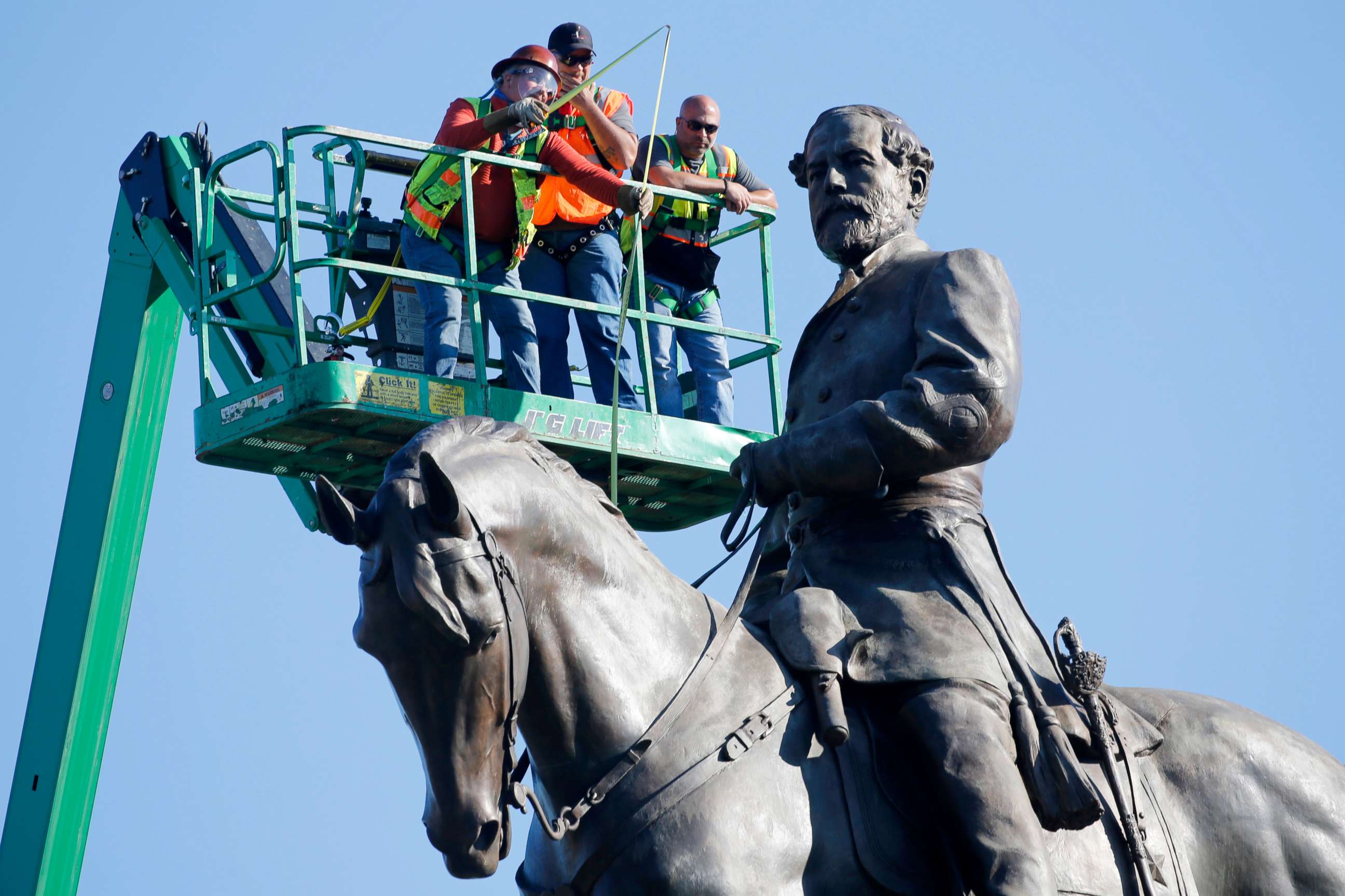 PHOTO: An inspection crew from the Virginia Department of General Services takes measurements as they inspect the statue of Confederate Gen. Robert E. Lee on Monument Avenue, June 8, 2020, in Richmond, Va.