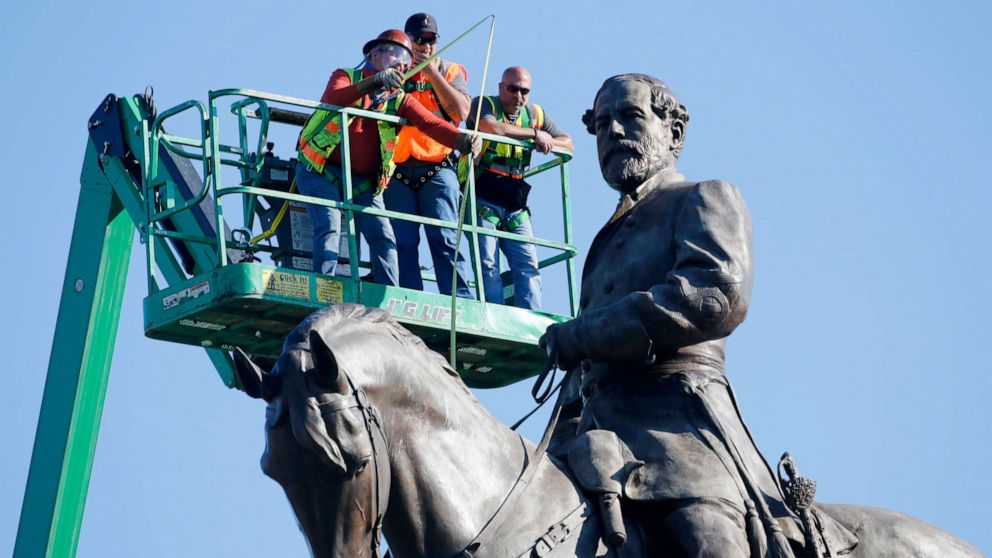 PHOTO: An inspection crew from the Virginia Department of General Services takes measurements as they inspect the statue of Confederate Gen. Robert E. Lee on Monument Avenue, June 8, 2020, in Richmond, Va.