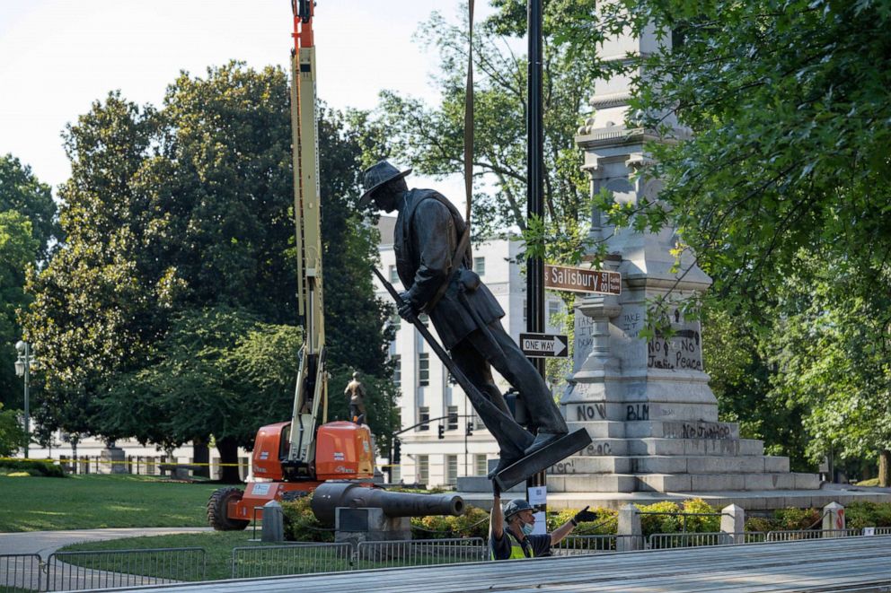 PHOTO: Crews work on removing the North Carolina Confederate monument at the North Carolina State Capitol in Raleigh, N.C., June 21, 2020.