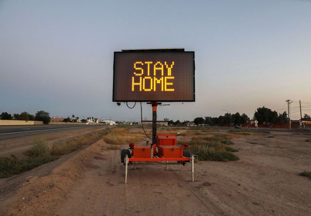 PHOTO: A message is posted reading 'Stay Home' in Imperial County which has been hard-hit by the COVID-19 pandemic, July 23, 2020, in El Centro, Calif.