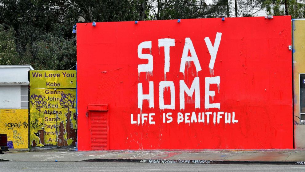 PHOTO: A mural seen in Los Angeles, California, on April 6, 2020 delivers a simple message, "Stay home, life is beautiful."