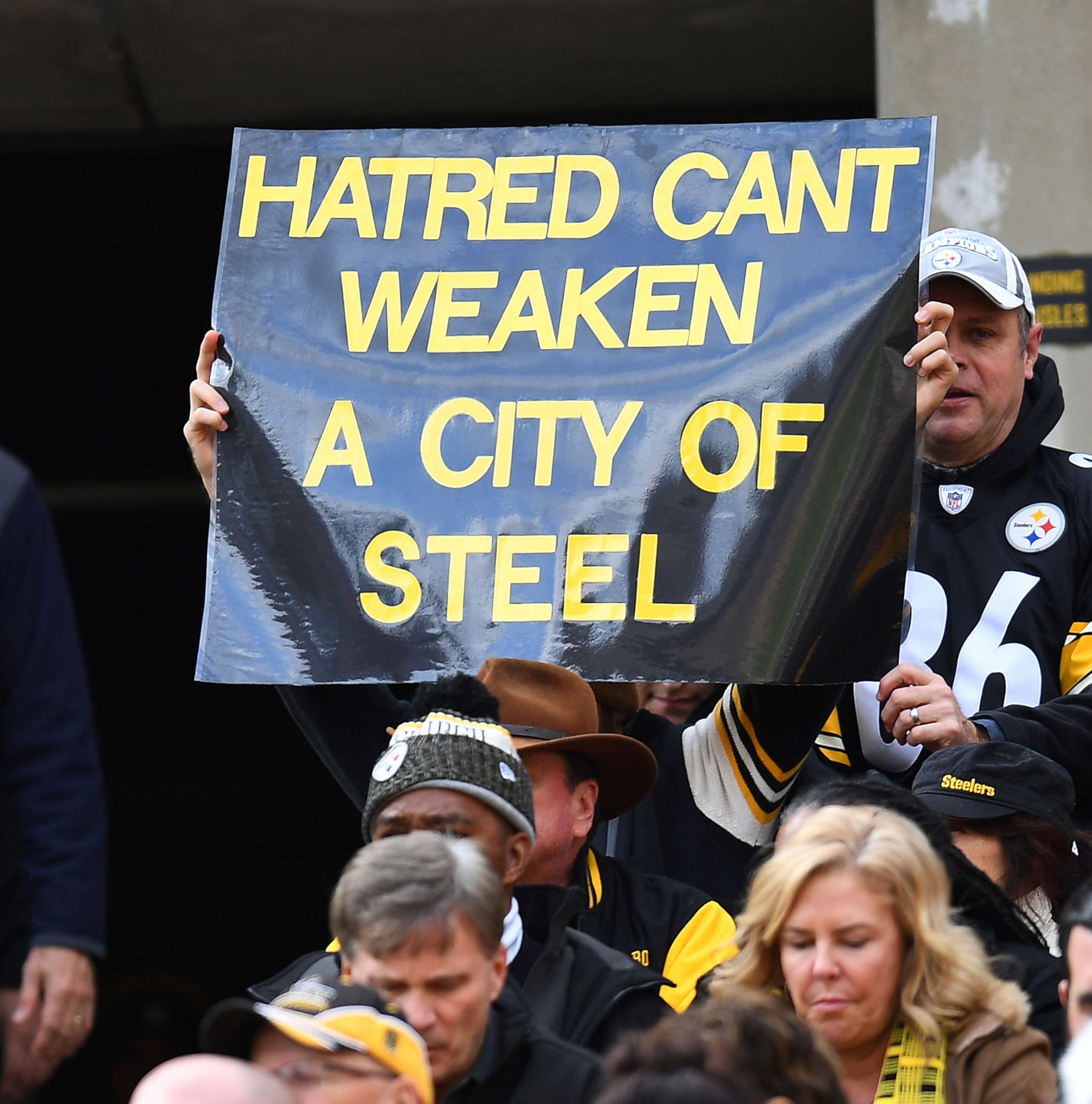 PHOTO: A fan holds up a sign to honor the victims of the shooting at the Tree of Life Synagogue during the game between the Pittsburgh Steelers and the Cleveland Browns at Heinz Field, Oct. 28, 2018 in Pittsburgh.