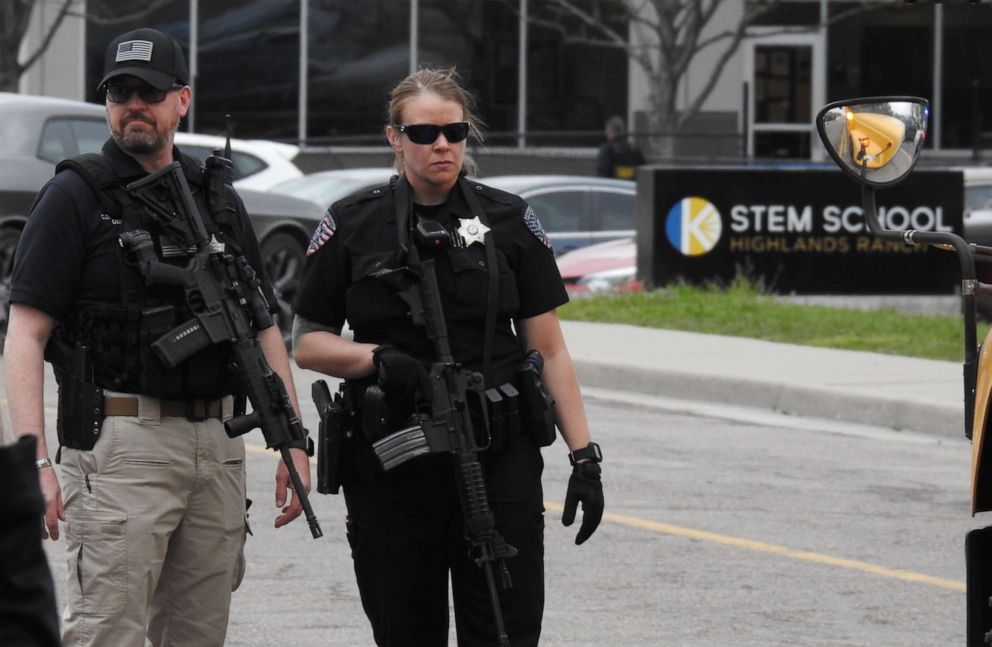 PHOTO: Officers stand guard in front of STEM School Highlands Ranch after a shooting, May 7, 2019, in  Highlands Ranch, Colo.