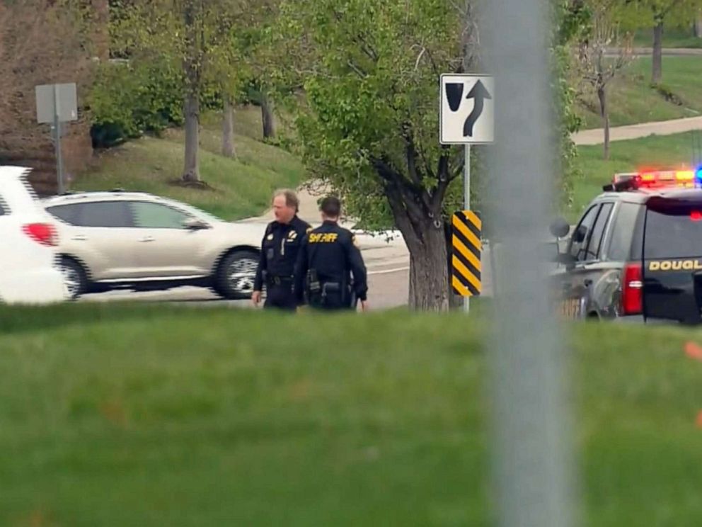 PHOTO: Police direct traffic near a meetup area after reports of a shooting at STEM School Highlands Ranch in Highlands Ranch, Colo., May 7, 2019.