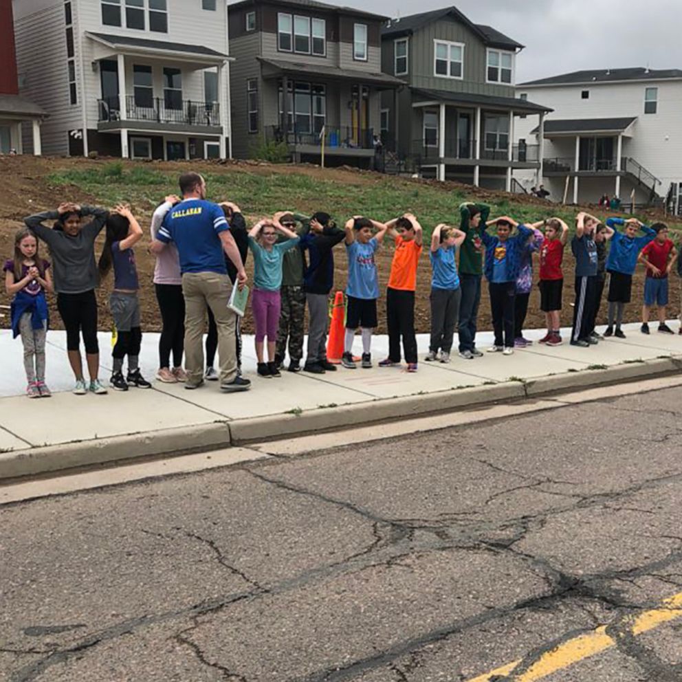 PHOTO: Children stand with their hands on their heads in a photo shared on social media after a shooting at STEM School Highlands Ranch in Highlands Ranch, Colo., May 7, 2019.