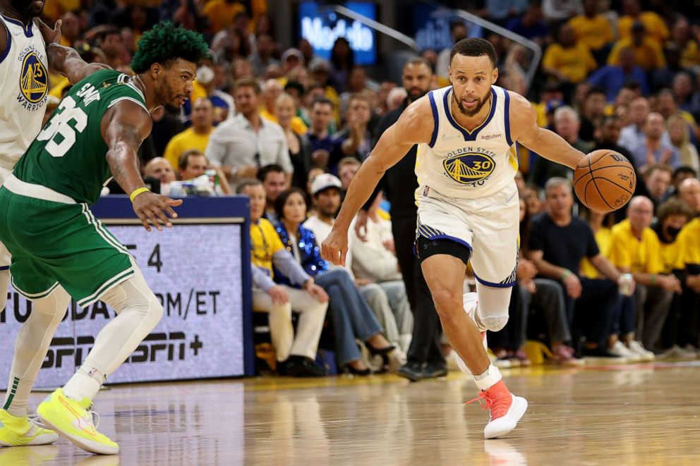 PHOTO: Stephen Curry of the Golden State Warriors dribbles past Marcus Smart of the Boston Celtics during the third quarter in Game Two of the 2022 NBA Finals at Chase Center, on June 5, 2022, in San Francisco.