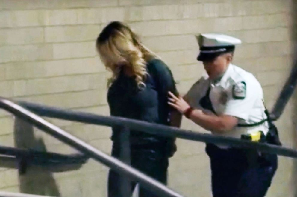 PHOTO: Stephanie Clifford, also known as Stormy Daniels, is led into jail in Columbus, Ohio, after being taken into custody, July 12, 2018.