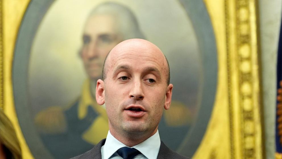 PHOTO: White House deputy chief of staff for policy, Stephen Miller watches as President Donald Trump speaks with reporters as he signs executive orders in the Oval Office at the White House, Feb. 10, 2025, in Washington.