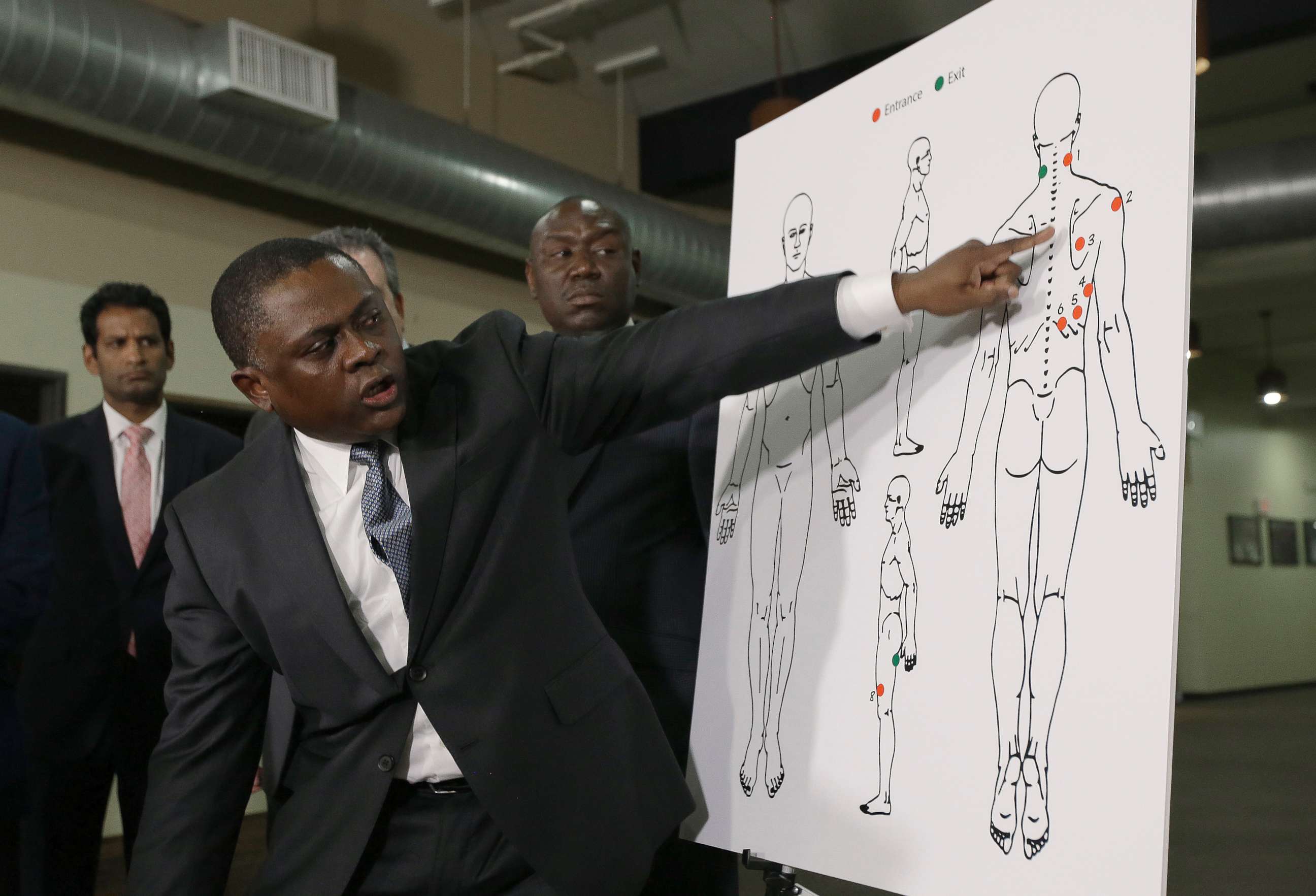 PHOTO: Pathologist, Dr. Bennet Omalu, gestures to a diagram showing the gun shot wounds he found on the body of police shooting victim Stephon Clark, during a news conference, March 30, 2018, in Sacramento, Calif.
