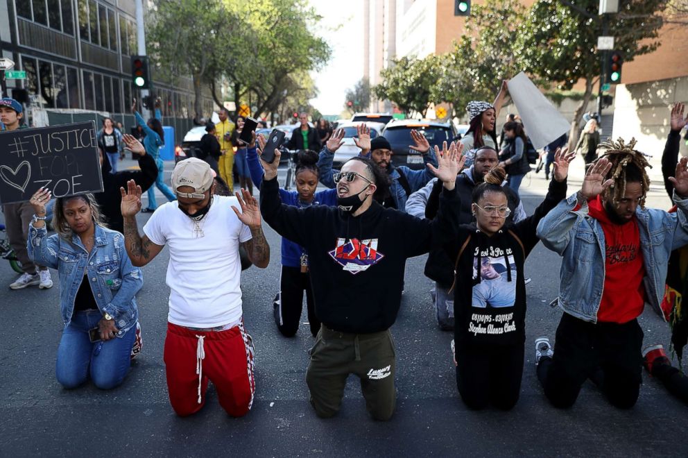 PHOTO: Black Lives Matter protesters block an intersection during a demonstration, March 23, 2018 in Sacramento, Calif.