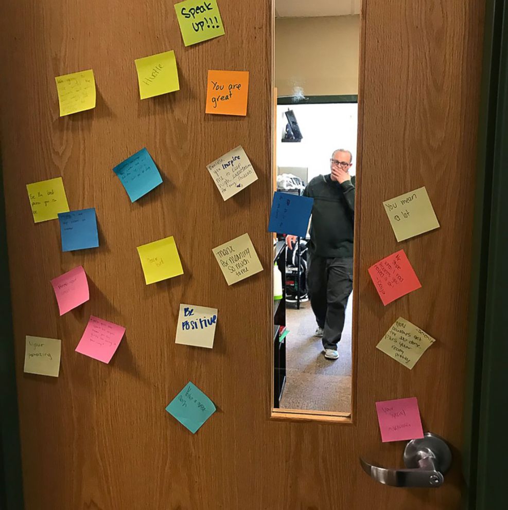 PHOTO: A door at Arbor Preparatory High School in Michigan covered with post-it notes that had words of love and encouragement.