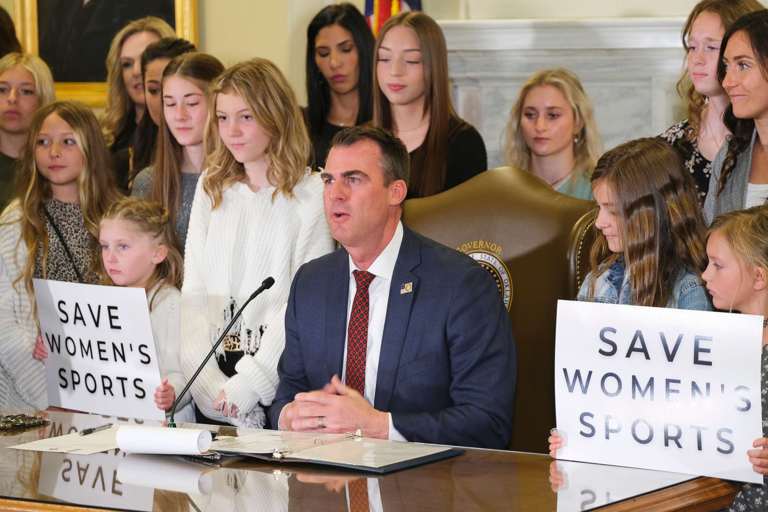 PHOTO: Governor Kevin Stitt signs SB2, the Save Women in Sports Act, in the Blue Room at the Capitol, March 30, 2022.
