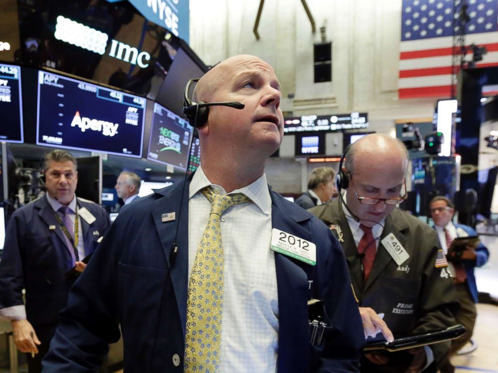 PHOTO: Trader Patrick Casey, center works on the floor of the New York Stock Exchange, May 29, 2018.